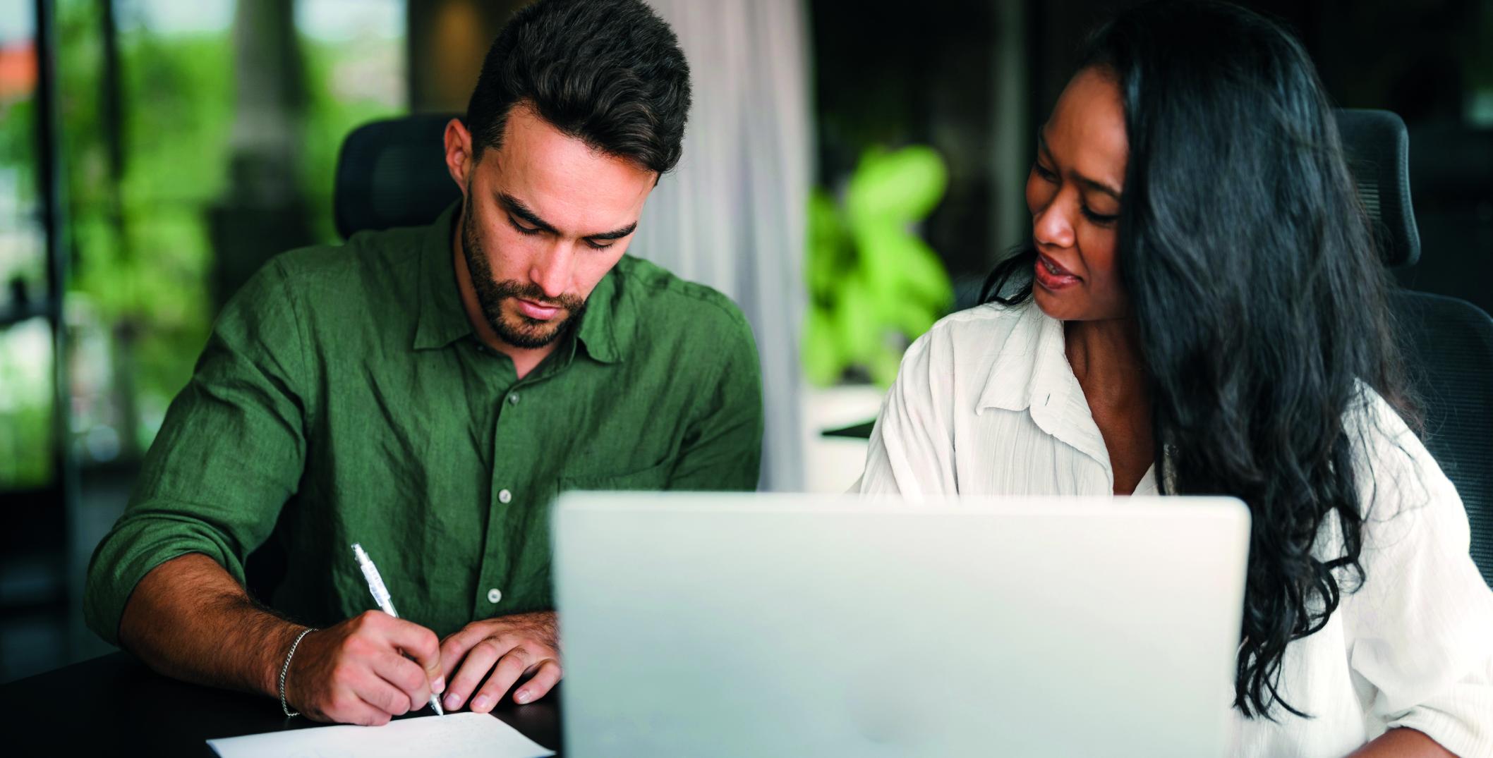Two individuals discussing strategy