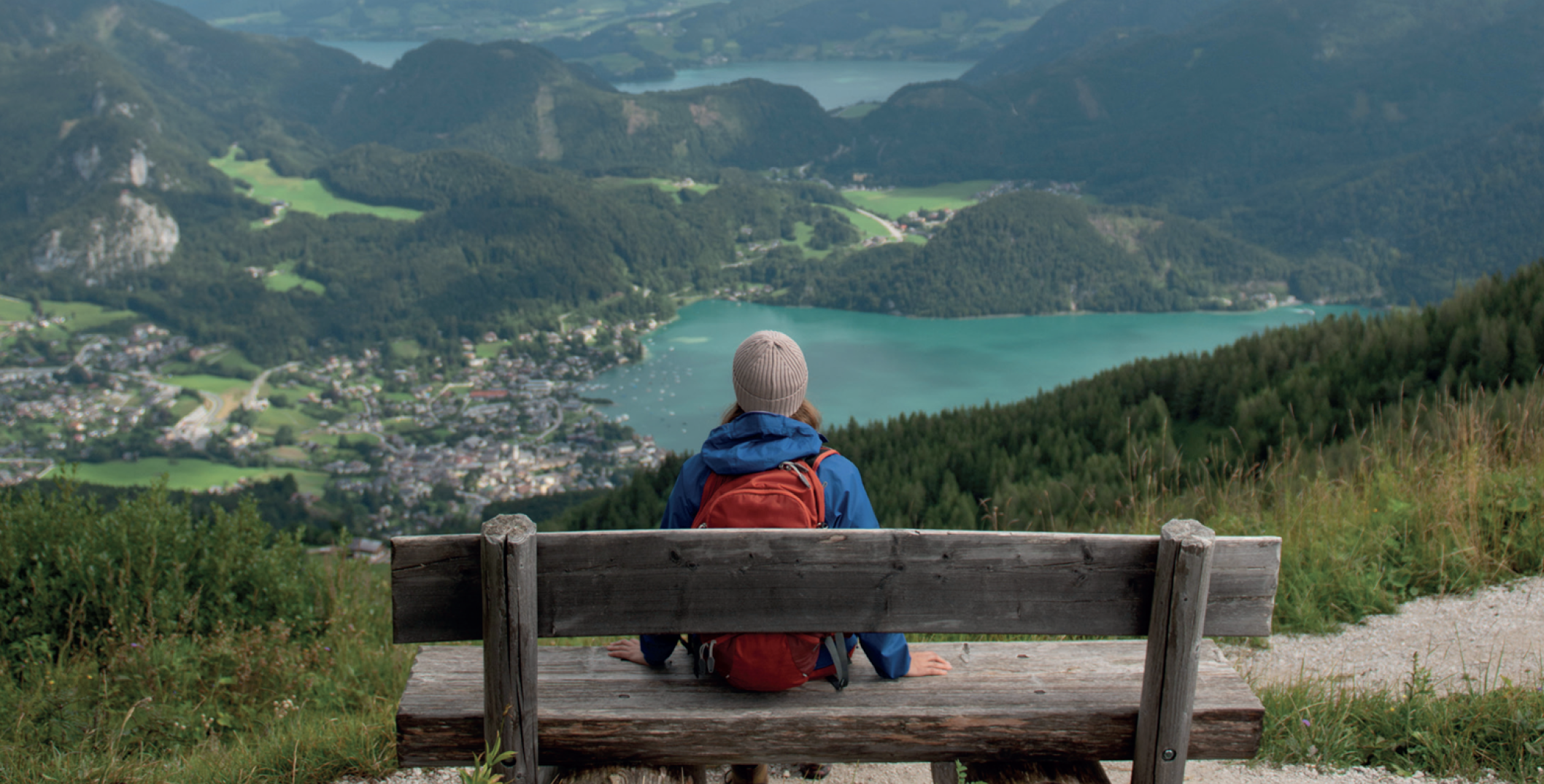 Person sitting in front of a valley