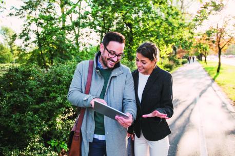 Two people discussing wealth management